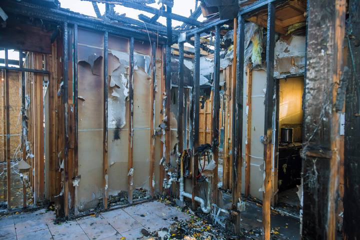 Fire-damaged interior wall framing